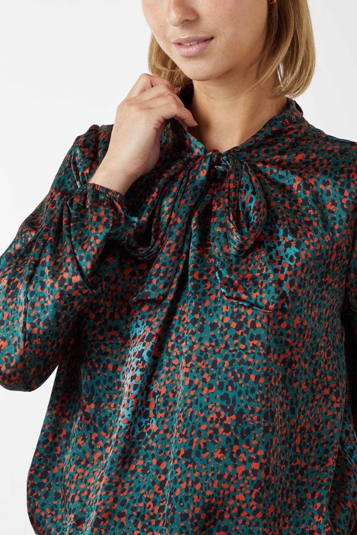 Orange, teal and black pussybow blouse