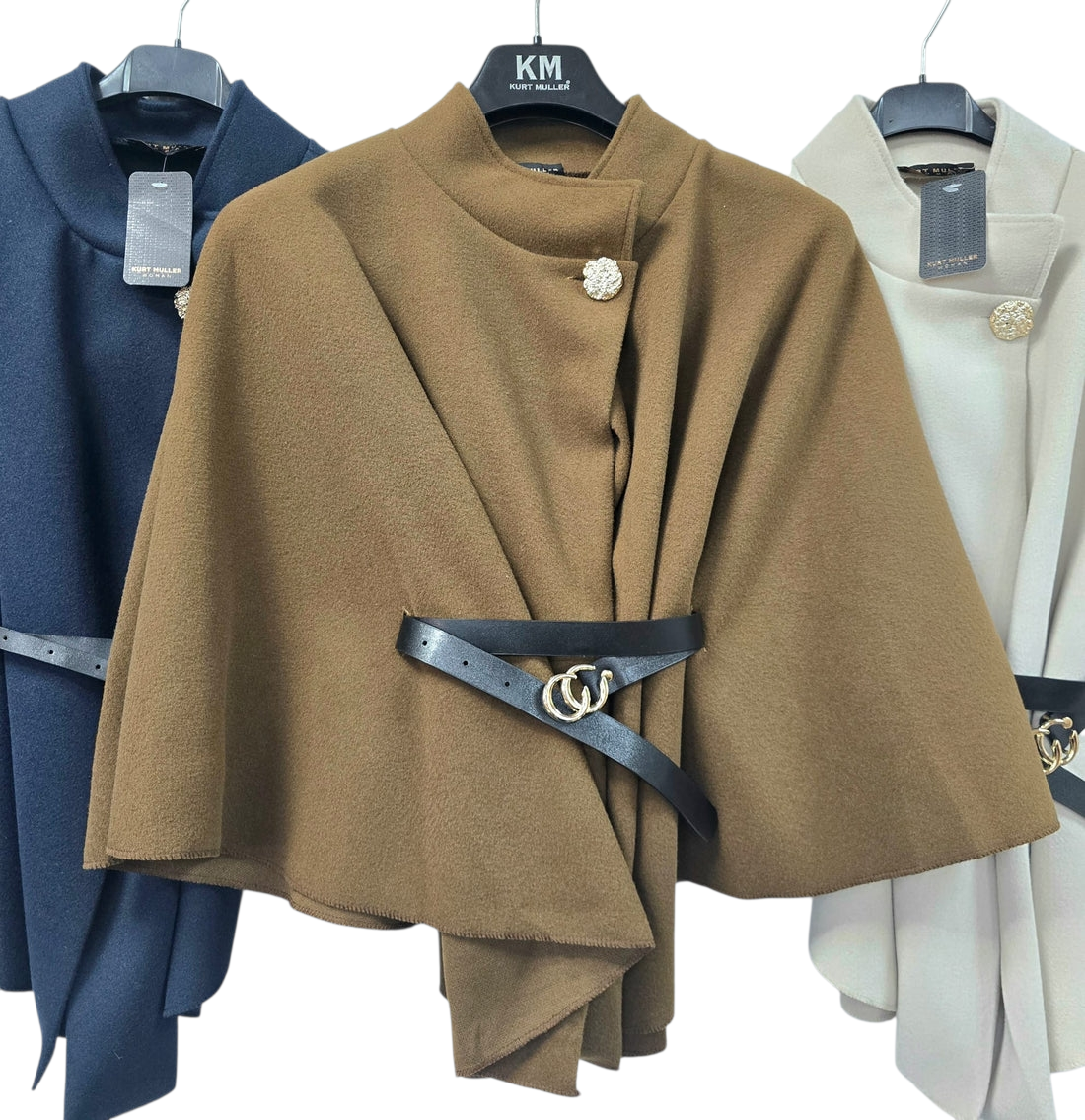 Cape with chunky black belt in camel, cream and navy